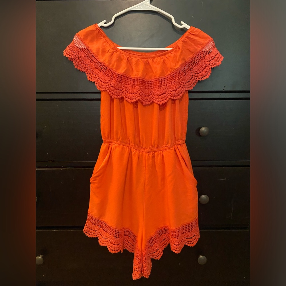 An orange romper, size small, brand m i a m a.